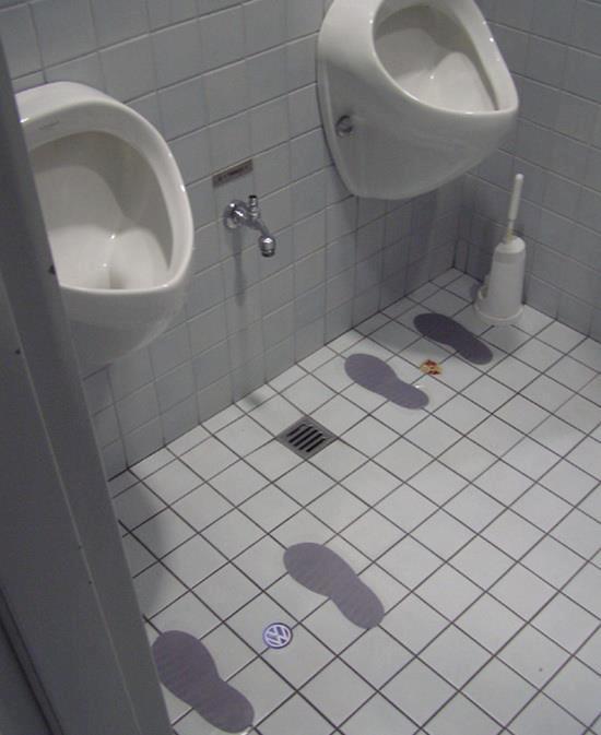 Footprint On The Floor Of Man's Toilet Volkswagen vs Lamborghini