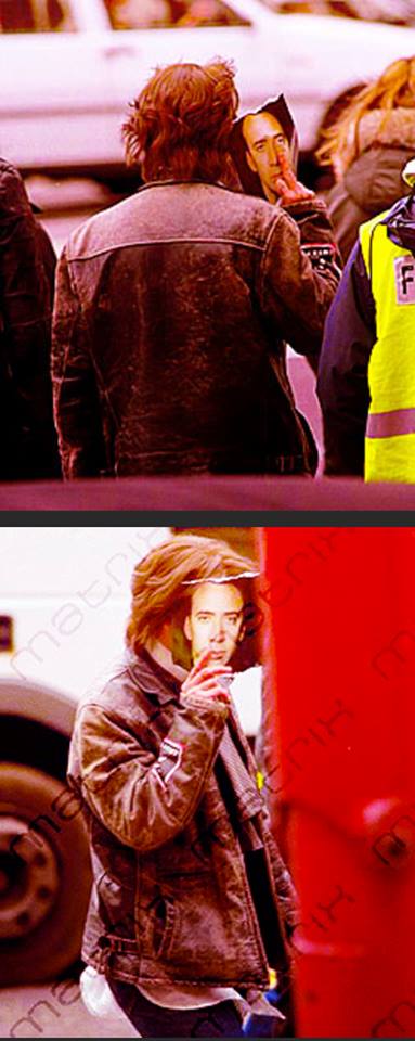 Johnny Depp hiding from paparazzi by using a Nicolas Cage Photo 